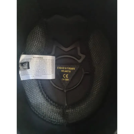 equestrian helmet front view with visor and metal element