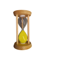 Hourglass with yellow sand in wooden construction seen from another angle