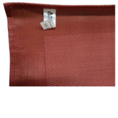 View of the protective table mat partially unrolled on a green background