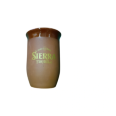 View of the ceramic mug with 'Sierra Tequila' print against a green background