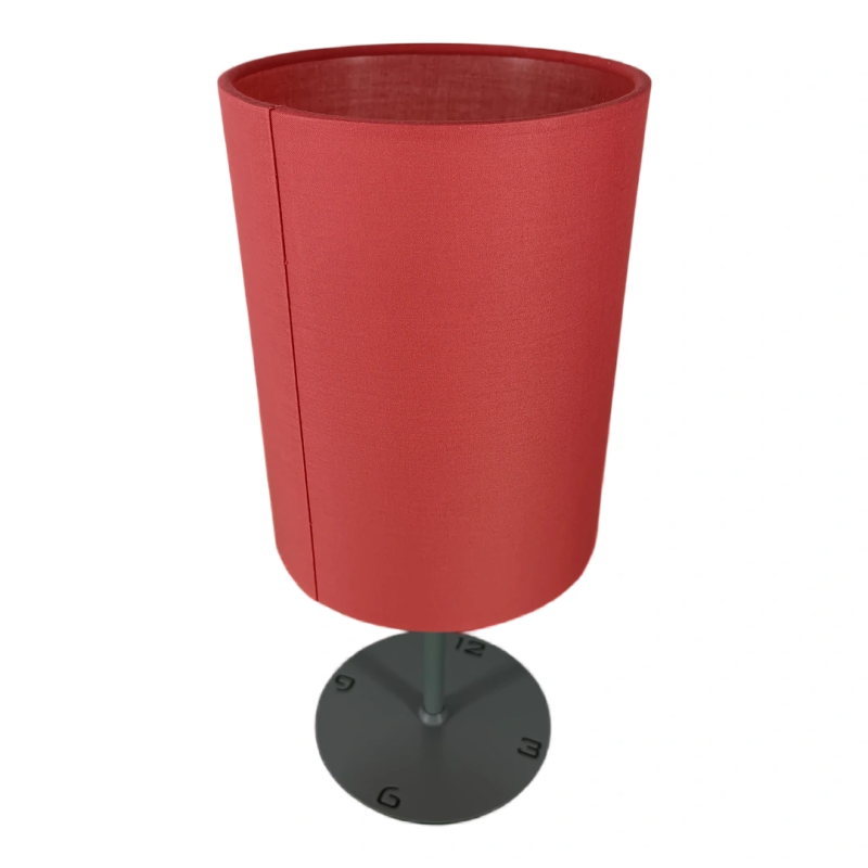 Table lamp with red shade and base with hour markings
