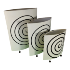 Lamp shade made of white material with black spiral pattern