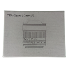 TTArtisan 10mm F2 lens packaging on a green background with a ruler