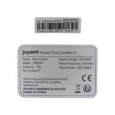 otwarty garnek do ryżu z widocznym kablem zasilającym w środku