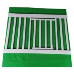 White metal safety gate on a green background