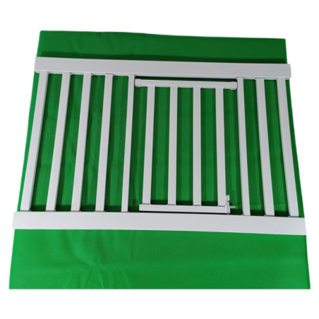 White metal safety gate on a green background