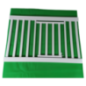 White metal safety gate on a green background
